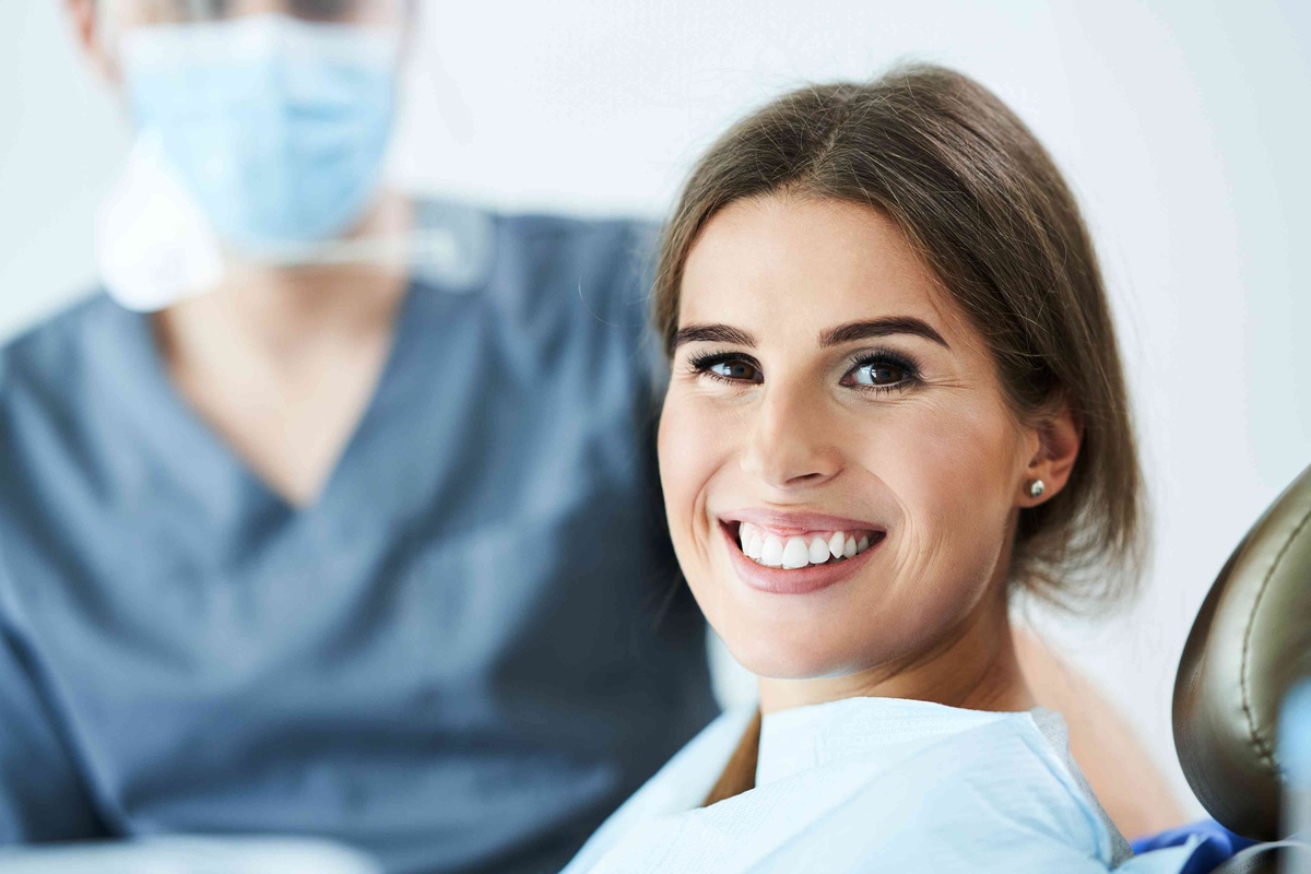 Patient discussing Invisalign treatment and clear smile alignment with a dentist
